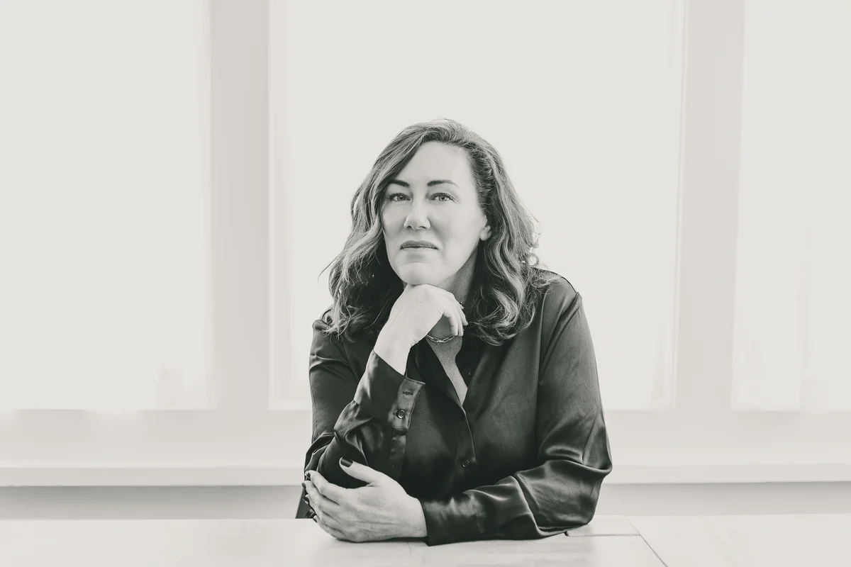 Jennifer Davidson, former social work supervisor and founder of The Unsafe Social Worker, in a contemplative black-and-white portrait